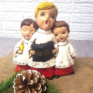 Handcrafted ceramic choir kids
